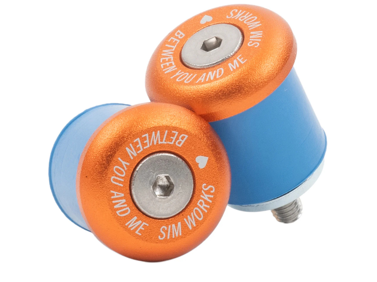 SimWorks Sim Drops 24 Bar Ends in Sunrise orange with blue silicone expanders and stainless bolts — for 24mm drop handlebars, "Between You and Me / Sim Works" engraved on the face